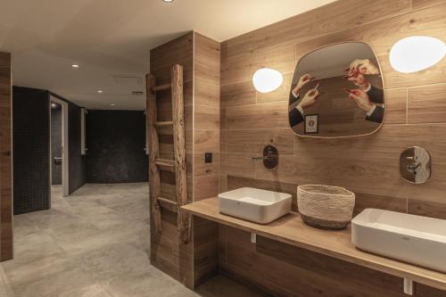 a bathroom with a sink and a mirror at Canopee 206 - by Care Concierge in Saint-Gervais-les-Bains