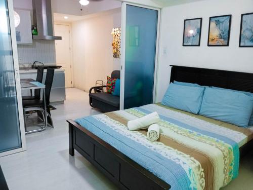a bedroom with a large bed in a room at Azure Tropical Paradise in Manila