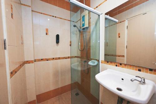 a bathroom with a sink and a shower at Stay C Hotel in Ban Samet