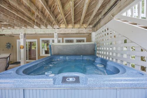 a jacuzzi tub in the middle of a house at 4096 - Cake by the Ocean in Duck