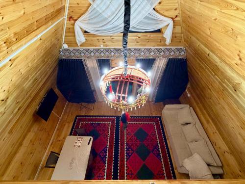 an overhead view of a chandelier in a room at A-Frame in Dolinka
