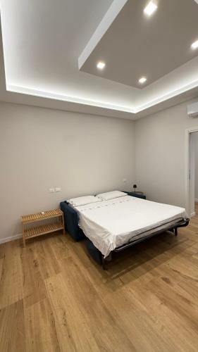 a bedroom with a bed in the middle of a room at Villa Miranda RELAX in Ortona