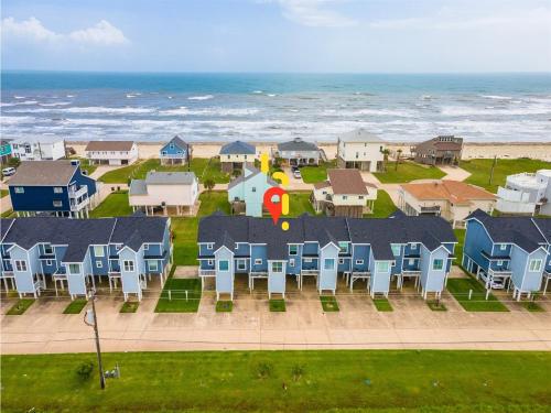 an aerial view of a row of houses near the beach at Gulf-View Townhome Hot Tub 2-Min Beach Walk in Galveston