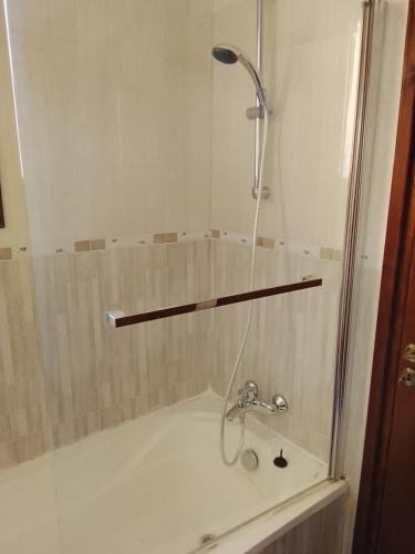 a shower in a bathroom with a sink at Millennium falcon in Larnaca
