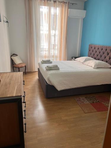 a bedroom with a large bed and a window at Eden Riviera in Beausoleil