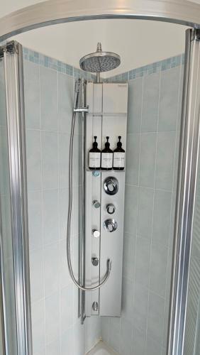 a shower in a bathroom with a shower at Happy House - Marina Centro in Rimini