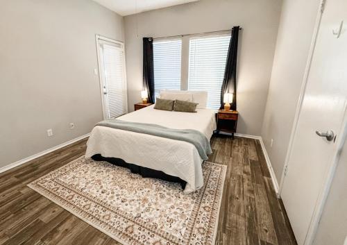 a bedroom with a bed and a window at Spacious Poolside Oasis - Easy Access and Garage in Corpus Christi