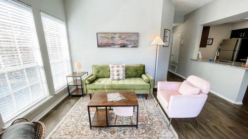 a living room with a couch and a table at Pool View Escape - Near Shops and Dining in Corpus Christi