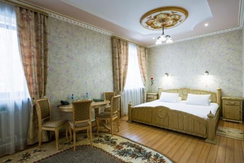 Vuode tai vuoteita majoituspaikassa Barskiye Polati Hotel