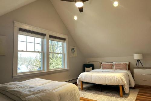 a bedroom with two beds and a window at 2BR Suite - Bright - Modern - Central AC - Parking in Arlington