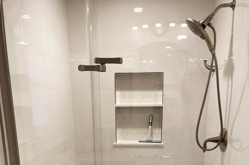 a shower with a glass door in a bathroom at 2BR Suite - Bright - Modern - Central AC - Parking in Arlington