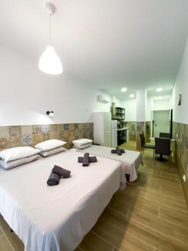 a hotel room with two beds and a kitchen at РUEВLO МAR, hotel-apartamento in Calpe