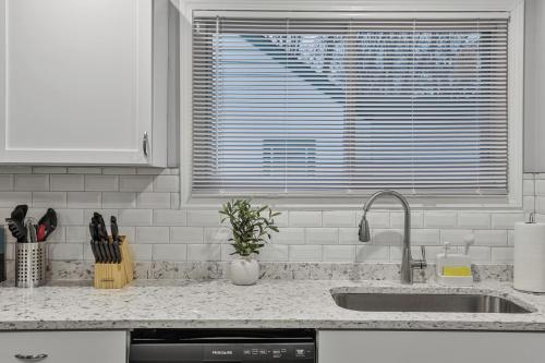a kitchen counter with a sink and a window at Cozy 4BR 2BA Worth Home in Worth