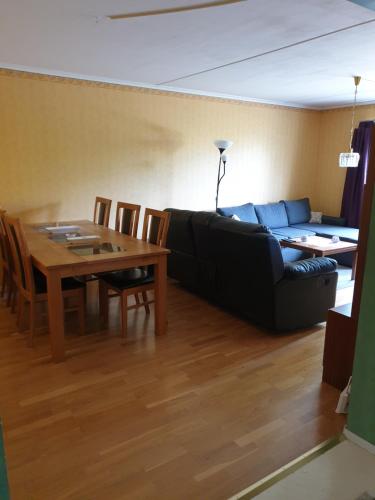 a living room with a couch and a table at Lägenhet in Köpingsvik