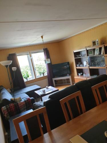 a living room with a couch and a table at Lägenhet in Köpingsvik