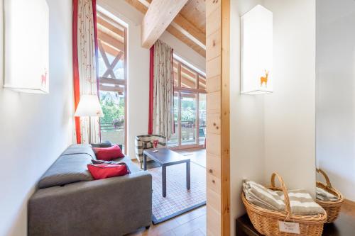 a living room with a couch and a table at Inntaler Hof in Seefeld in Tirol