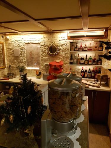 a kitchen with a pot on a stove at Esos Hotel Quelle in Bad Ragaz
