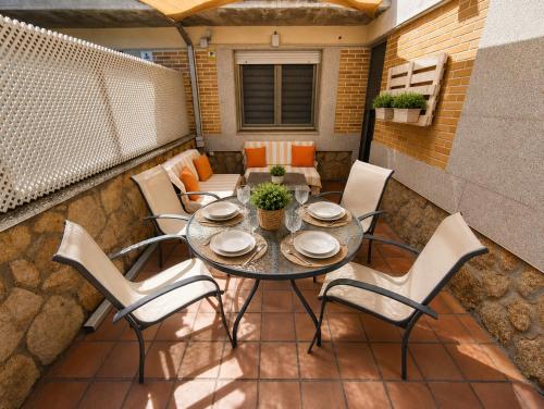 a table and chairs sitting on a patio at Casa Turística la Almunia in Castellanos de Moriscos