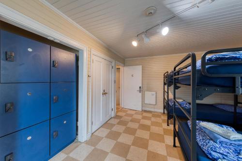 a room with two bunk beds and a hallway at HI Point Montara Lighthouse in Montara