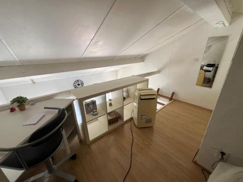 an office with a desk and chairs in a room at Studio au coeur de Aix in Aix-en-Provence