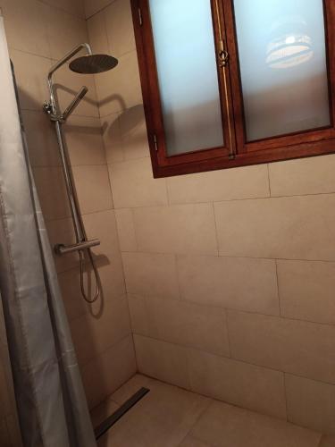a bathroom with a shower with a shower curtain at Casa de los Encantos in Vila do Porto