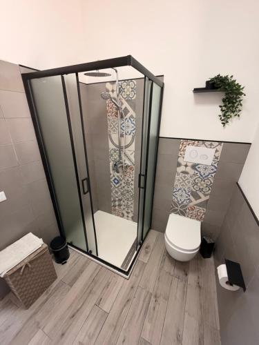 a bathroom with a shower and a toilet at Villa Marina Luxury in Balestrate