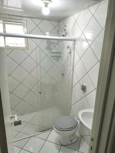 a bathroom with a shower and a toilet and a sink at Studio Centro Floripa 02 in Florianópolis