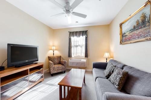 a living room with a couch and a tv at Comfortable Suite in Downtown Northeast Harbor w/ WiFi & AC - Walk to the Water in Northeast Harbor