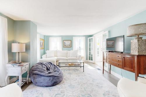 a living room with a couch and a tv at Beautiful Retreat | Home Office | Walk 5 MInutes to Main Street in Wiscasset