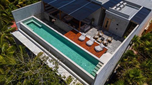 an overhead view of a house with a swimming pool at Luxury Beachfront 3BR Apt 102 | Neea Bahia Soliman in Balcheil