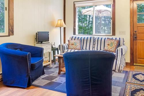 a living room with two chairs and a couch at Woodland Home near Long Pond w/ Spacious Living Area, Full Kitchen & Deck in Somesville