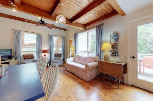 a kitchen and living room with a table and chairs at Home with deck, great location in the heart of Acadia National Park in Otter Creek