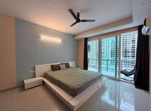 a bedroom with a bed and a ceiling fan at The Lake view Timber House in Hyderabad