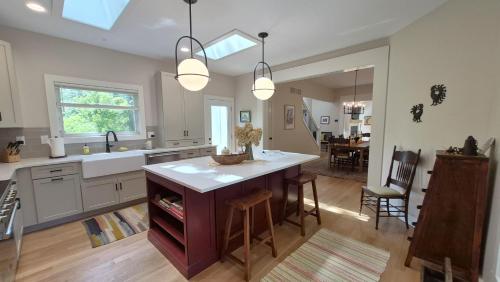 a kitchen with a island in the middle of a room at Prairie View in Sawyer