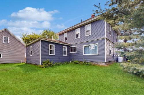 a house with a large yard in front of it at Charming Coastal Retreat with Ocean Views, Porch and Private Cabin in Sullivan