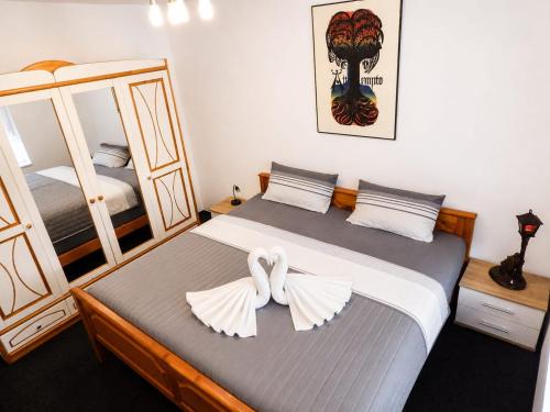 a bedroom with a bed with a bow on it at Landhaus Klein Markow in Jördenstorf