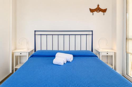 Llit o llits en una habitació de Cataldo Guest House