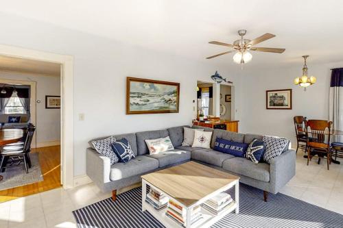 a living room with a couch and a table at Multi-unit with oar & boat house with private dock & kayaks in Boothbay Harbor