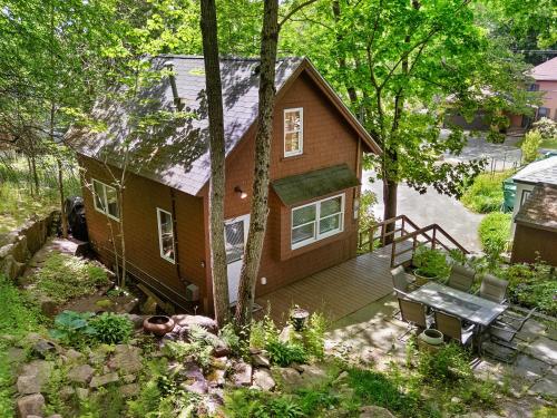 an aerial view of a small house with a porch at Two-Level Unit w/ Patio, Deck, Firepit, Private Washer/ Dryer, and Free WiFi in Seal Harbor