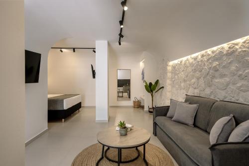 a living room with a couch and a table at Onyx Hotel & Suites in Karterados
