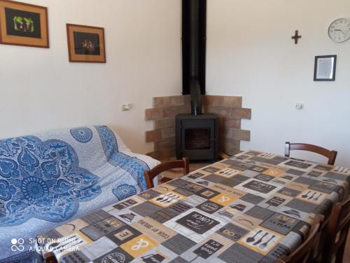 a living room with a table and a fireplace at Casa Panorama in Senigallia