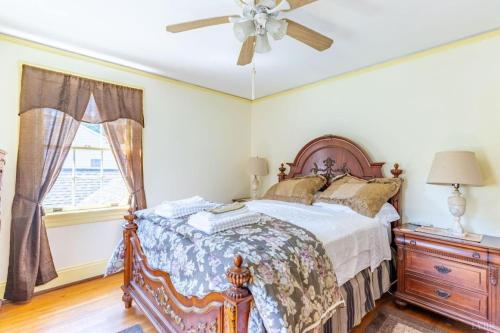 a bedroom with a bed and a ceiling fan at Welcome to your private cozy room #2 near LU, Stadium & general hospital in Lynchburg