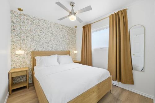 a bedroom with a bed and a window at The Birch in Wellington