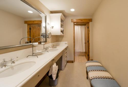 a bathroom with a sink and a mirror at The Chateaux Deer Valley in Park City
