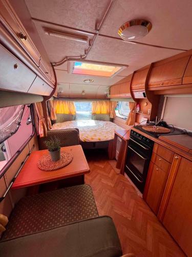 a small kitchen and living room in an rv at Каравана Кукер in Sozopol