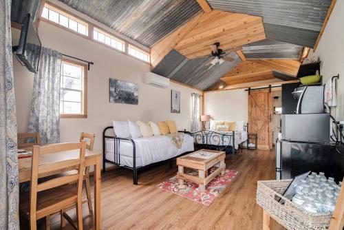 a living room with a couch and a table at Hill Country Cabin 3 in Canyon Lake
