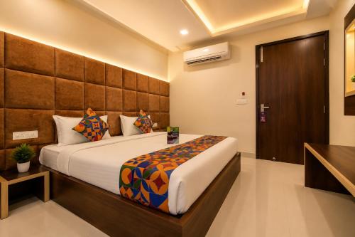 a bedroom with a large bed in a room at Hotel Nayyar Inn Near Golden temple in Amritsar
