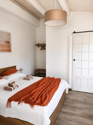 a bedroom with a large bed with white walls at Orizzonti in Ortona