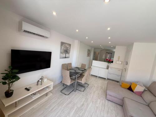 a living room with a couch and a table at Bella Apartment Playa Del Cura in Torrevieja