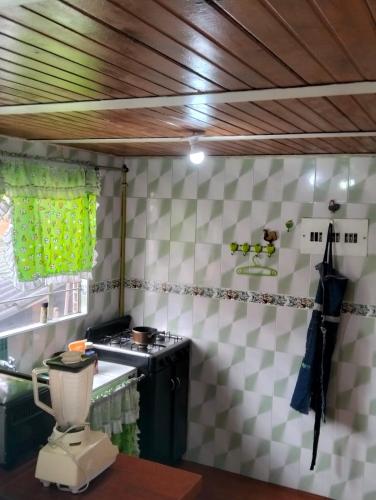 a kitchen with a sink and a toilet in a room at Hospedaje Patty Cajicá in Cajicá